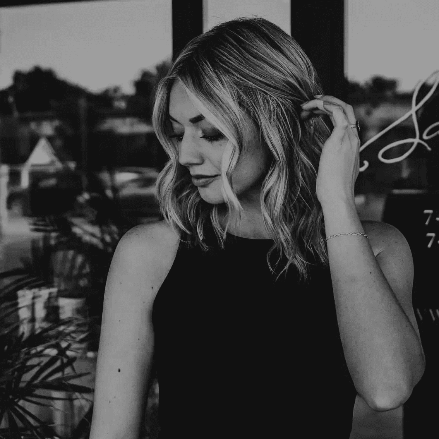 Portrait of Madison Pruitt, a professional stylist at Salon361, showcasing their expertise and style.
