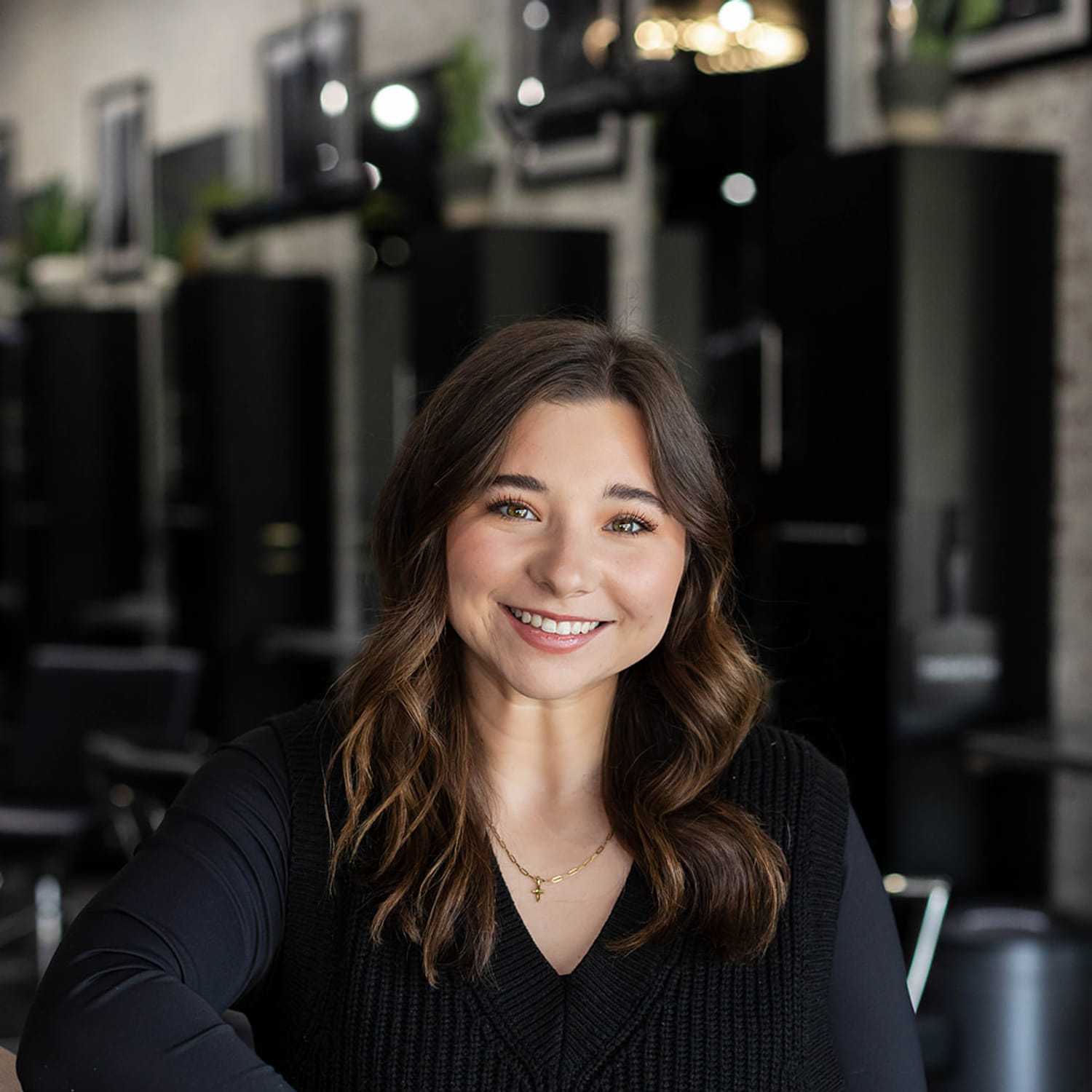 Portrait of Lexi Curry, a professional stylist at Salon361, showcasing their expertise and style.