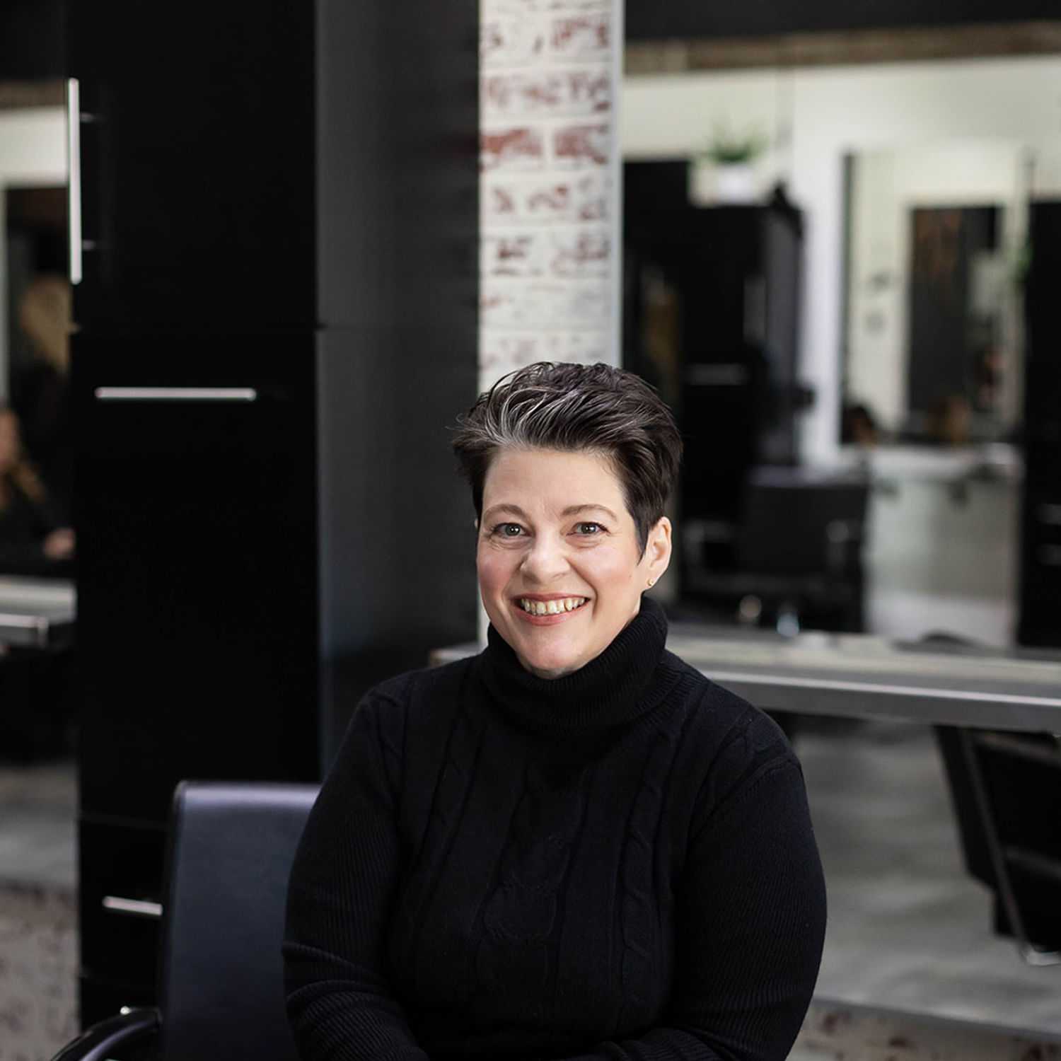 Portrait of Kristi Shoewalter, a professional stylist at Salon361, showcasing their expertise and style.