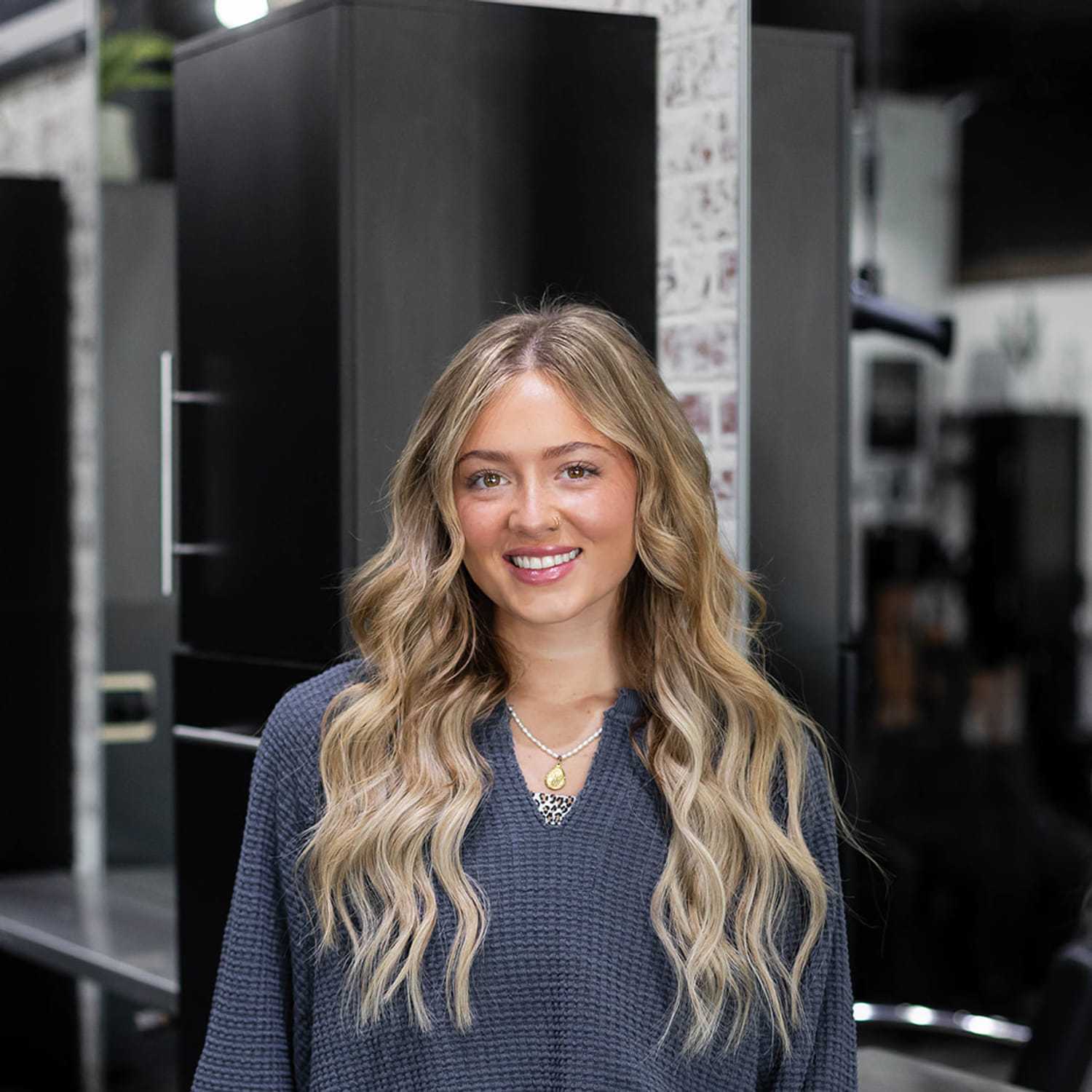 Portrait of Gracie Sheasby, a professional stylist at Salon361, showcasing their expertise and style.