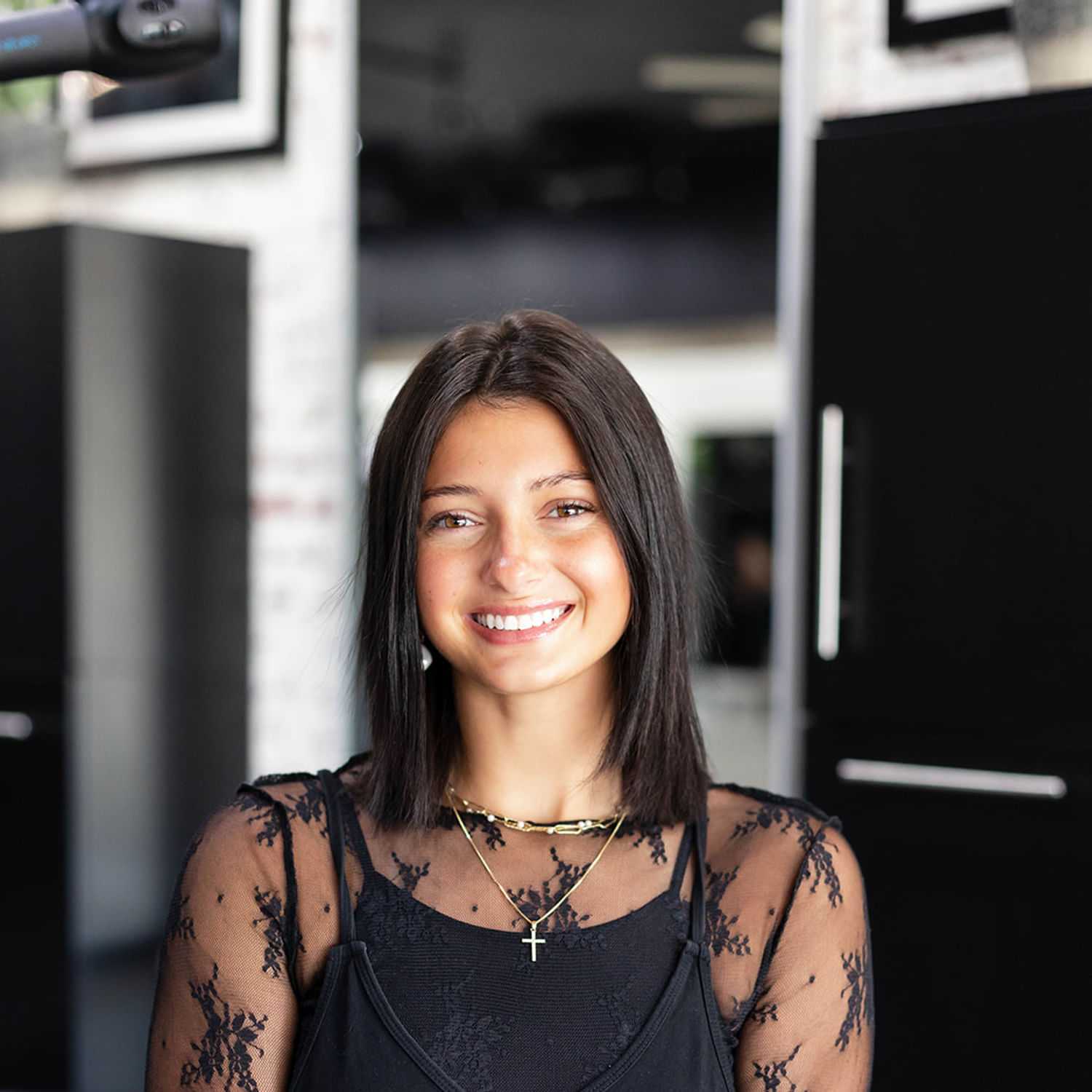 Portrait of Kiara Knepp, a professional stylist at Salon361, showcasing their expertise and style.