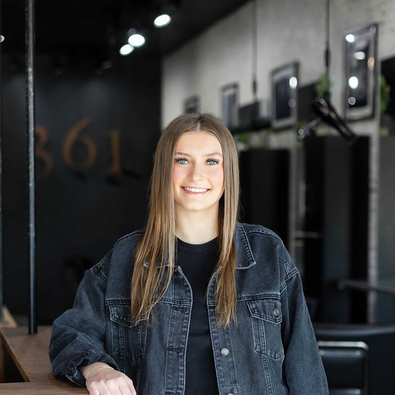 Portrait of Bella Beck, a professional stylist at Salon361, showcasing their expertise and style.