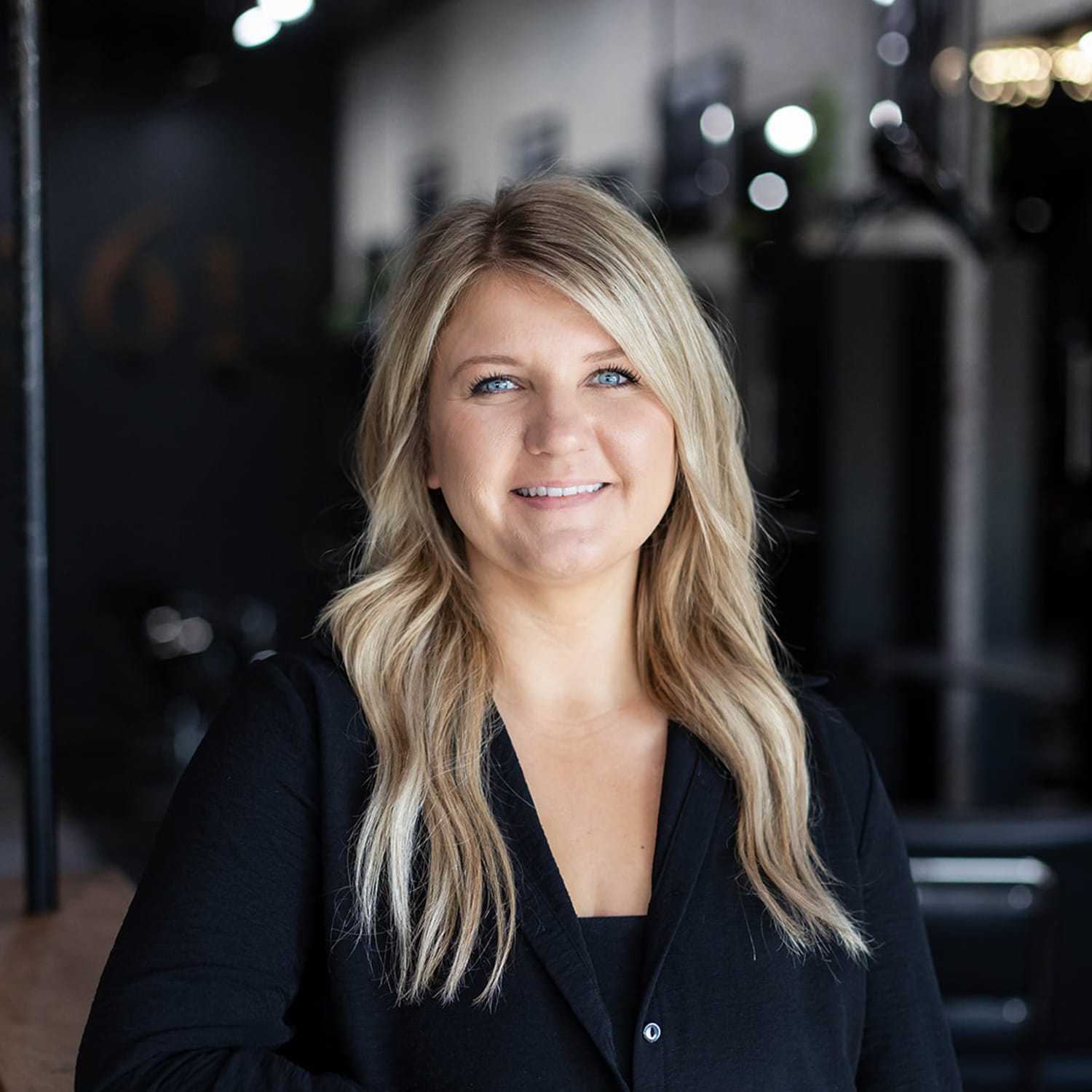 Portrait of Shannon Scott, a professional stylist at Salon361, showcasing their expertise and style.