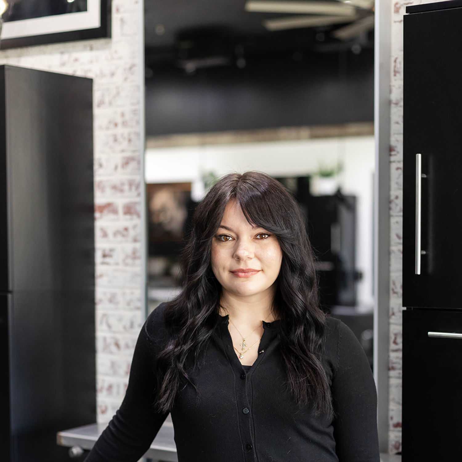 Portrait of Sara Henthorn, a professional stylist at Salon361, showcasing their expertise and style.