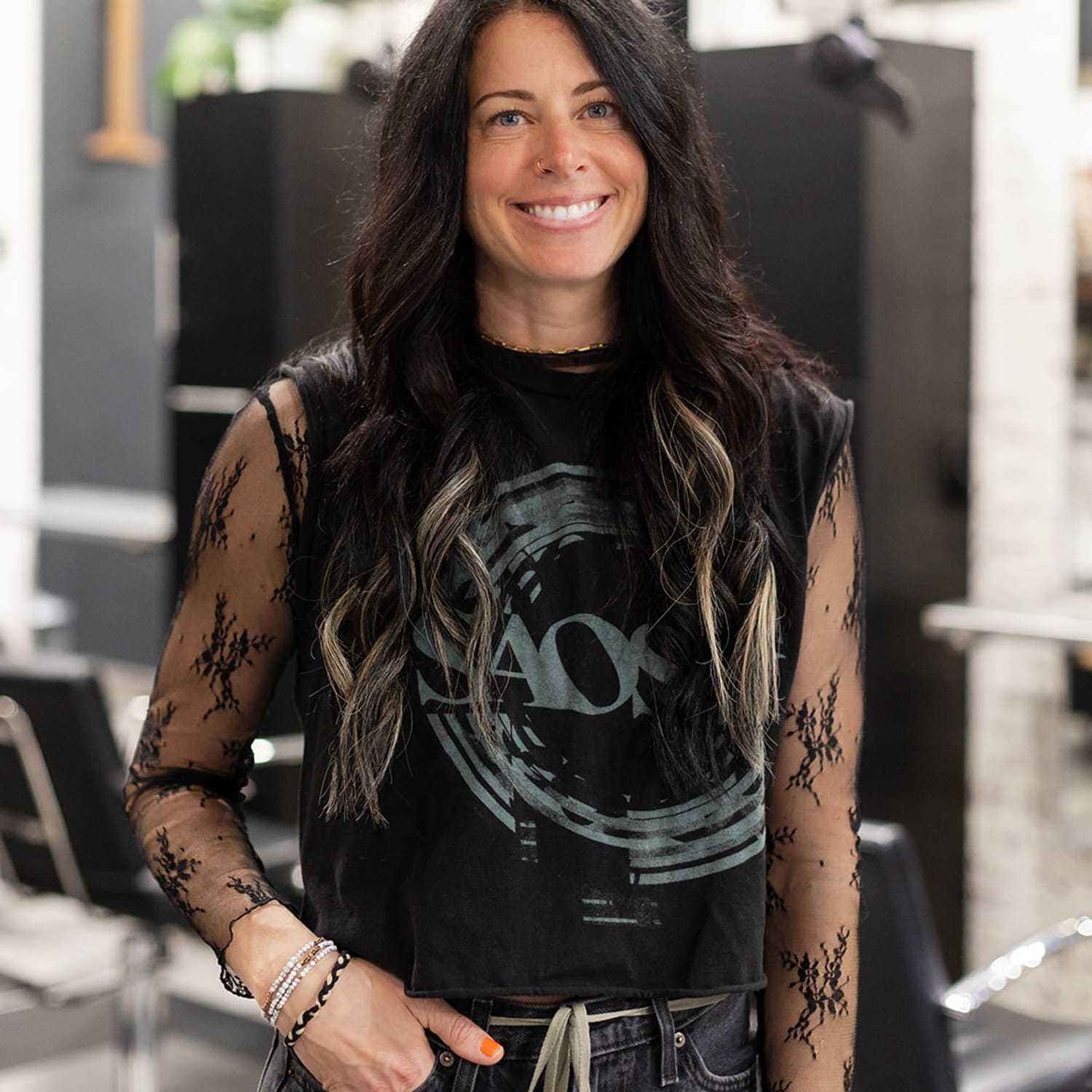 Portrait of Danielle Capaldi, a professional stylist at Salon361, showcasing their expertise and style.