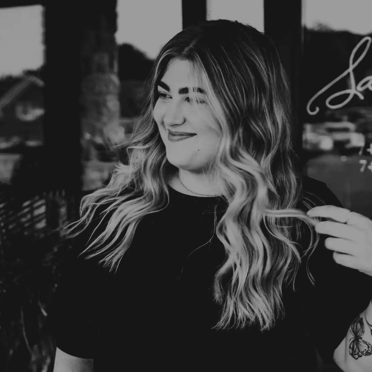 Portrait of Taylor Shoewalter, a professional stylist at Salon361, showcasing their expertise and style.