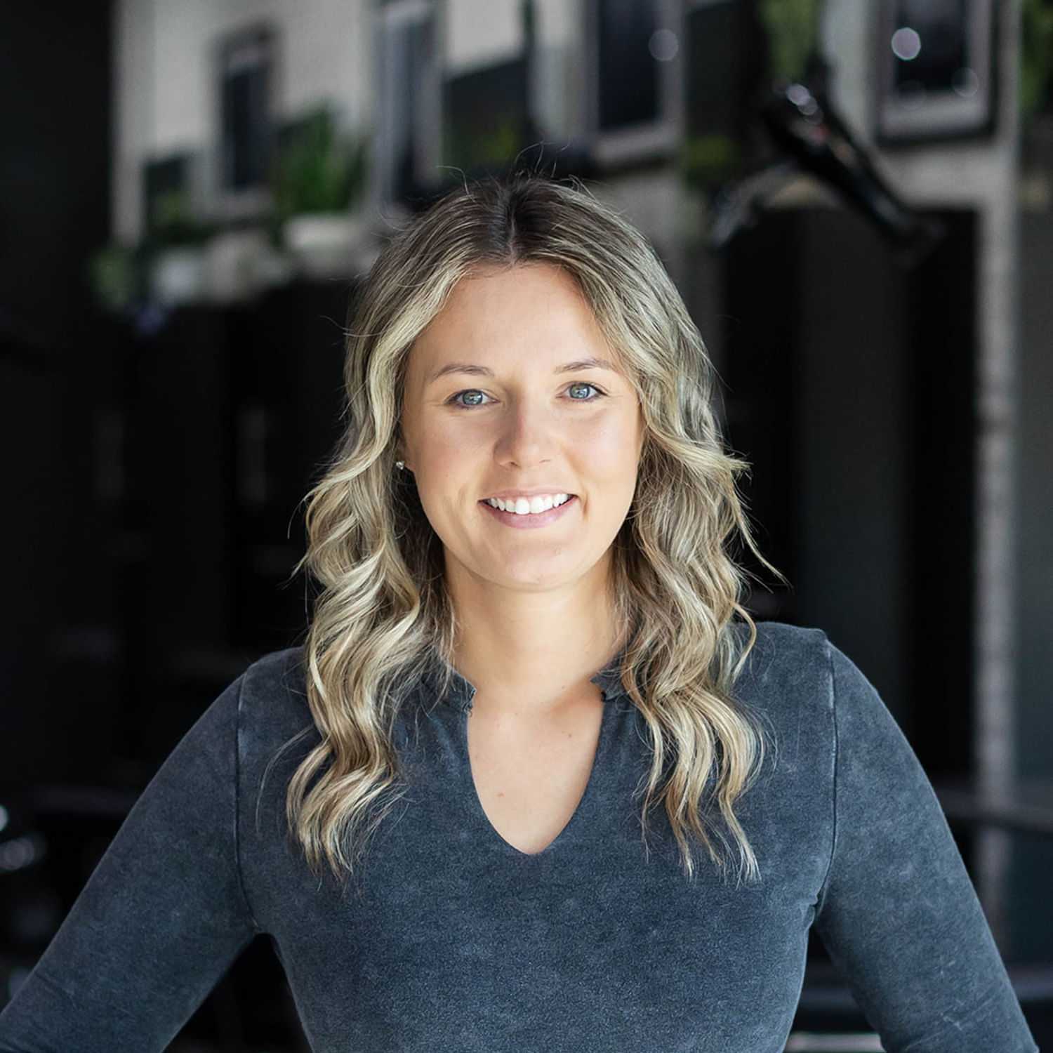 Portrait of Jordan Welker, a professional stylist at Salon361, showcasing their expertise and style.