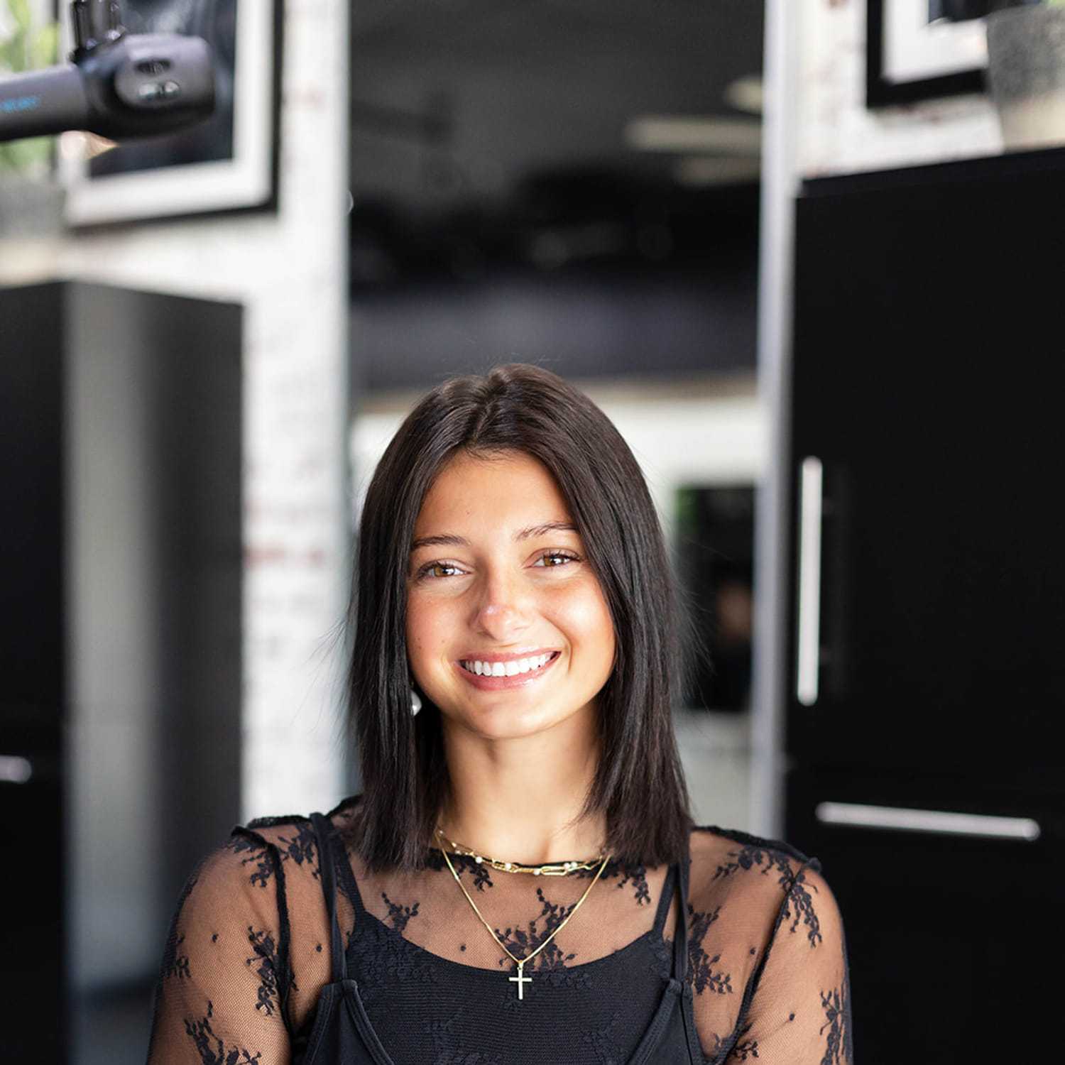 Portrait of Kiara Knepp, a professional stylist at Salon361, showcasing their expertise and style.