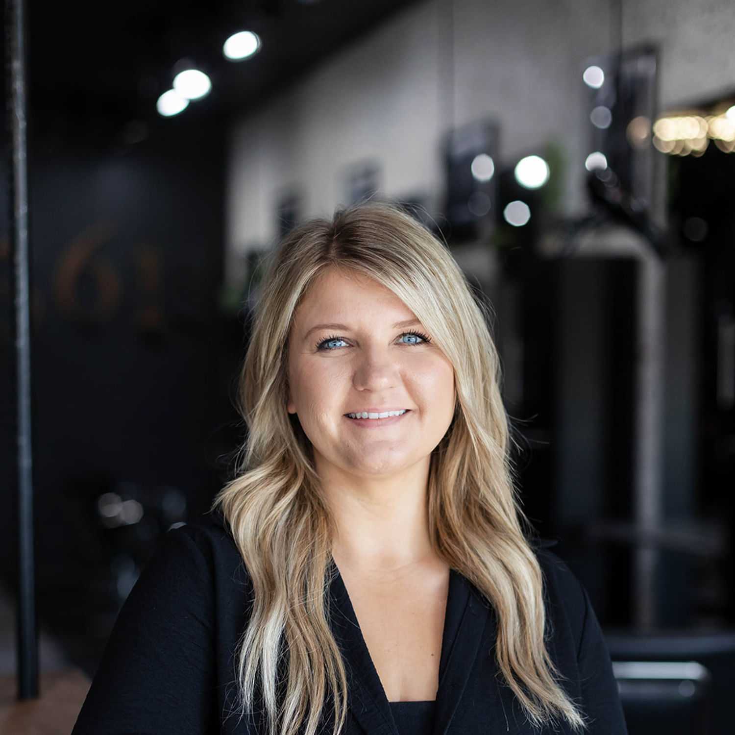 Portrait of Shannon Scott, a professional stylist at Salon361, showcasing their expertise and style.