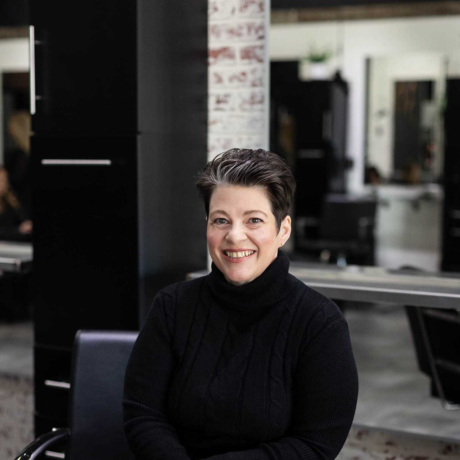 Portrait of Kristi Shoewalter, a professional stylist at Salon361, showcasing their expertise and style.