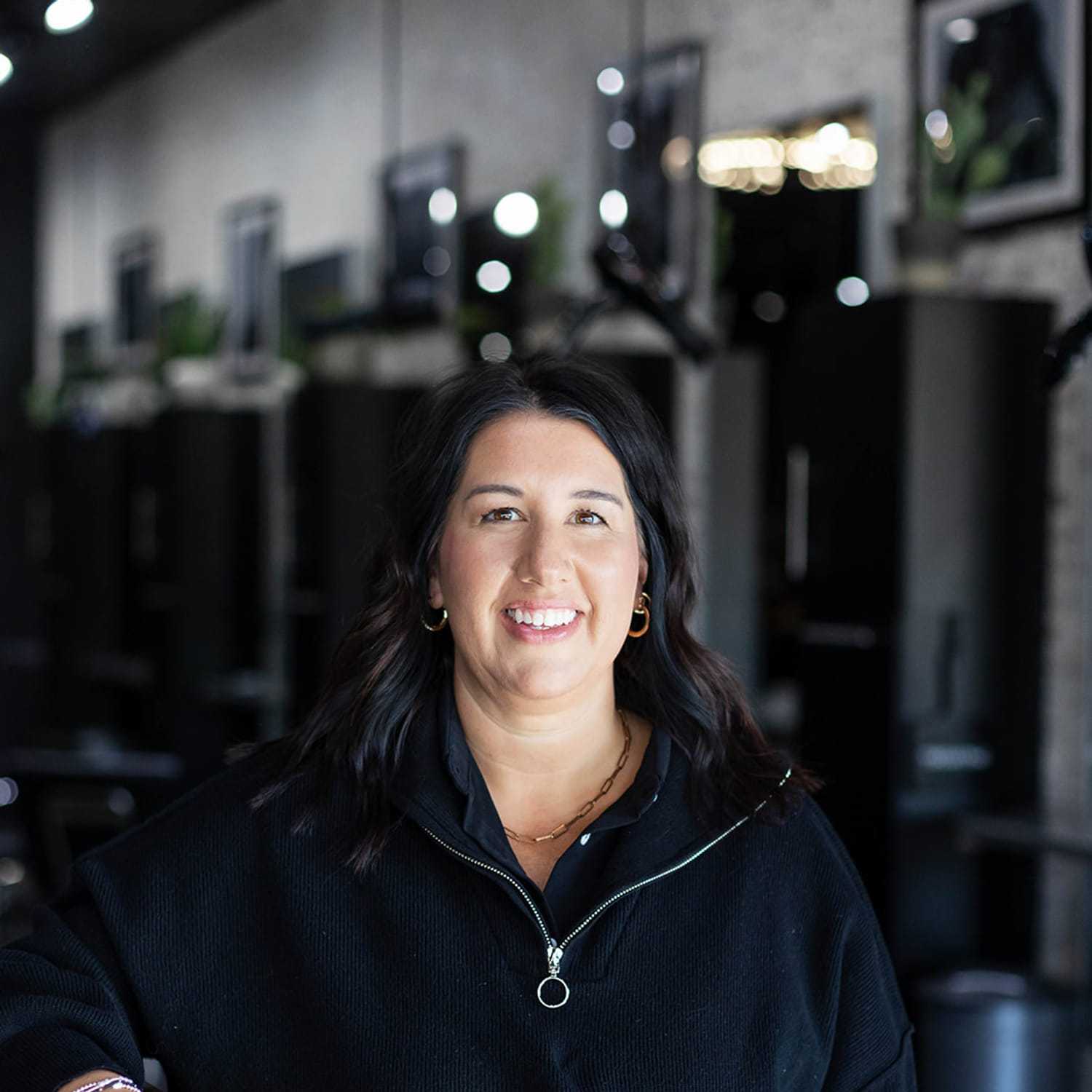 Portrait of Maribeth Waers, a professional stylist at Salon361, showcasing their expertise and style.
