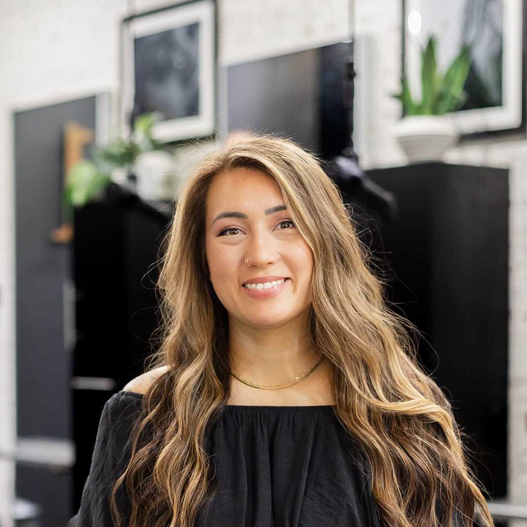 Portrait of Jayme Colopy, a professional stylist at Salon361, showcasing their expertise and style.