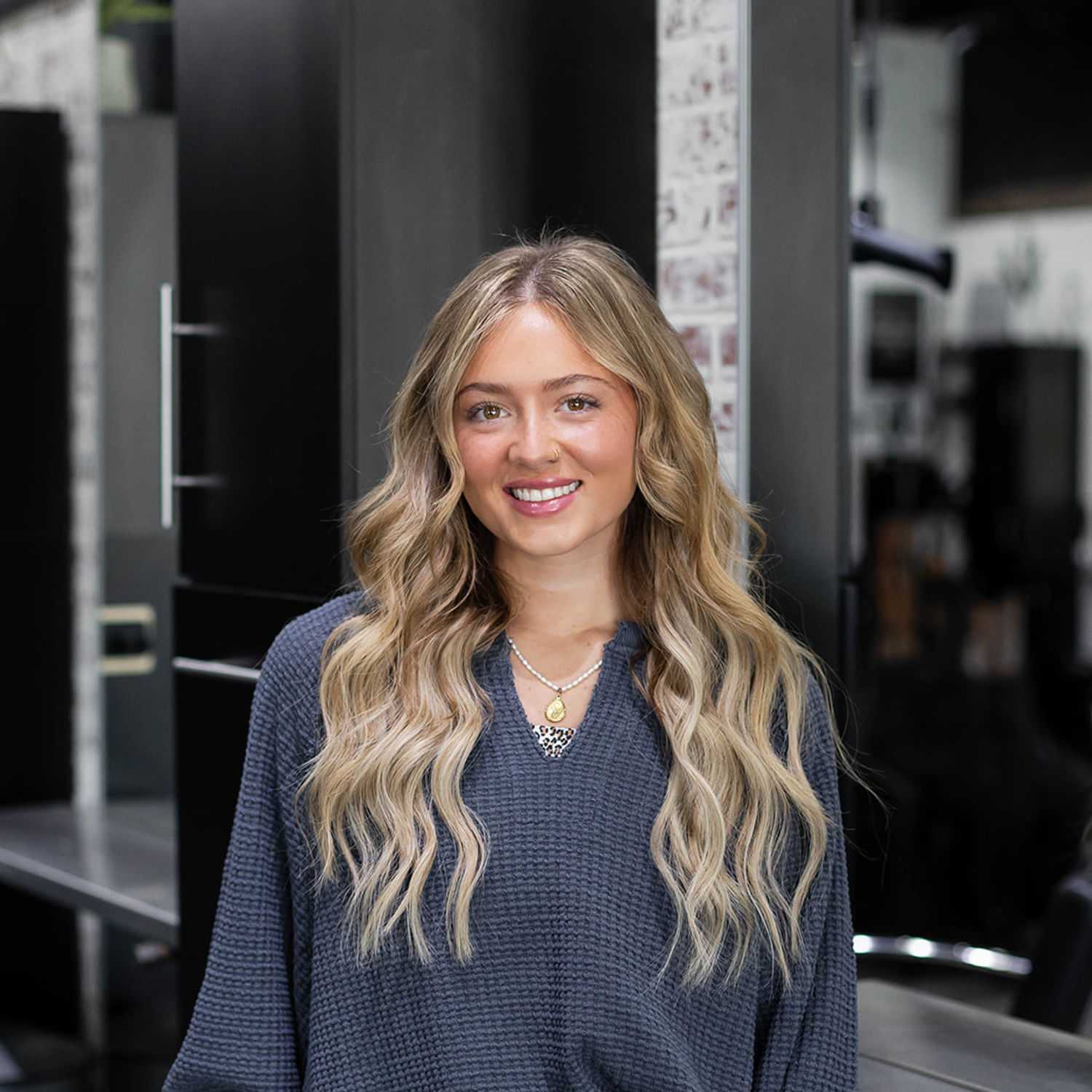Portrait of Gracie Sheasby, a professional stylist at Salon361, showcasing their expertise and style.